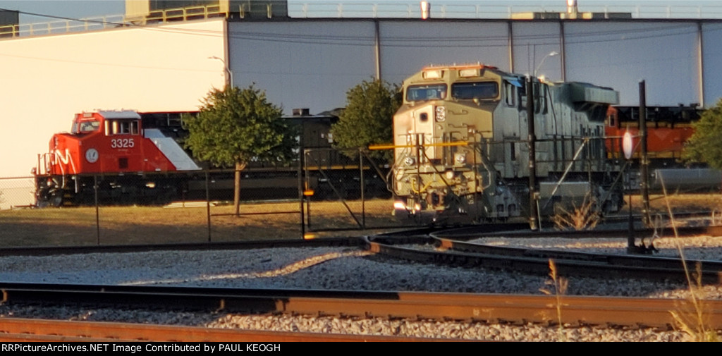 BNSF 3283, CN 3325, and BNSF 3667 Reflect The Texas Sun as it Sets!!!